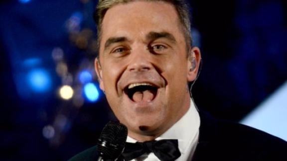 Robbie Williams continua la causa con Jimmy Page: "Non posso ancora trasferirmi"