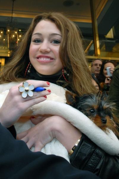 Miley Cyrus exits hotel on the way to a concert