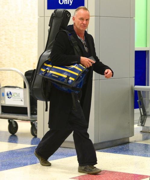 Sting sticks his tongue out as he departs JFK Airport