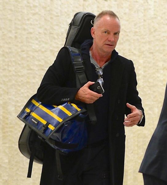 Sting sticks his tongue out as he departs JFK Airport
