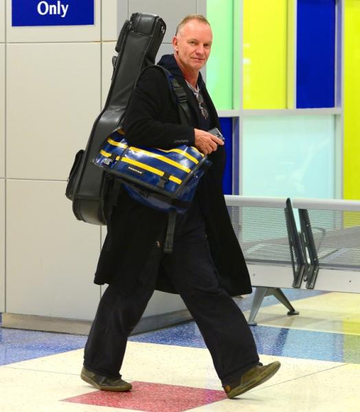 Sting sticks his tongue out as he departs JFK Airport