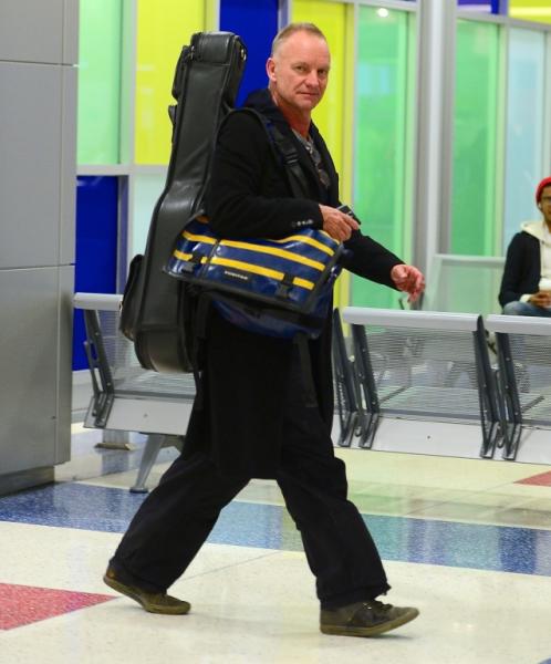 Sting sticks his tongue out as he departs JFK Airport